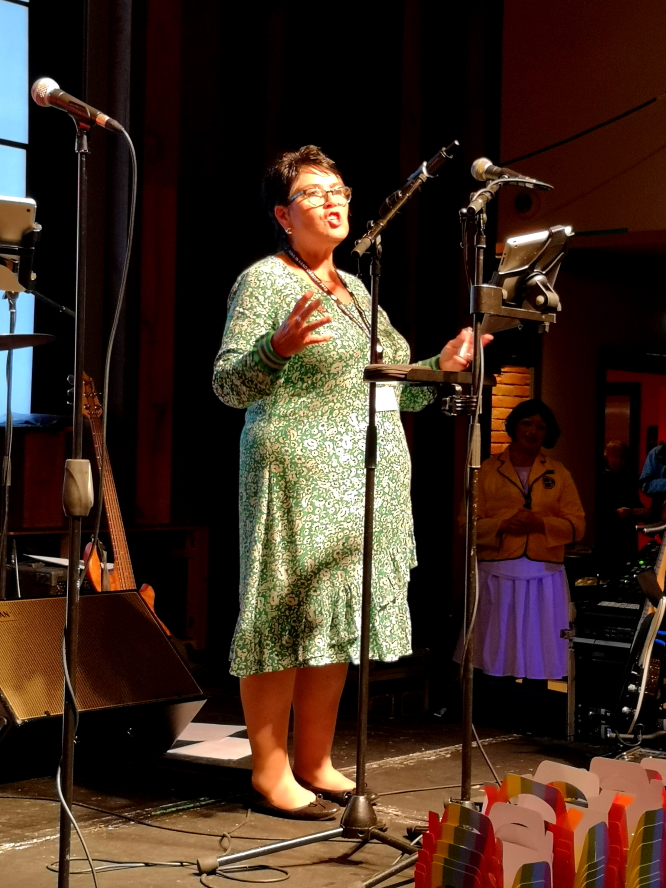 Sian James addressing delegates at Hand in Hand